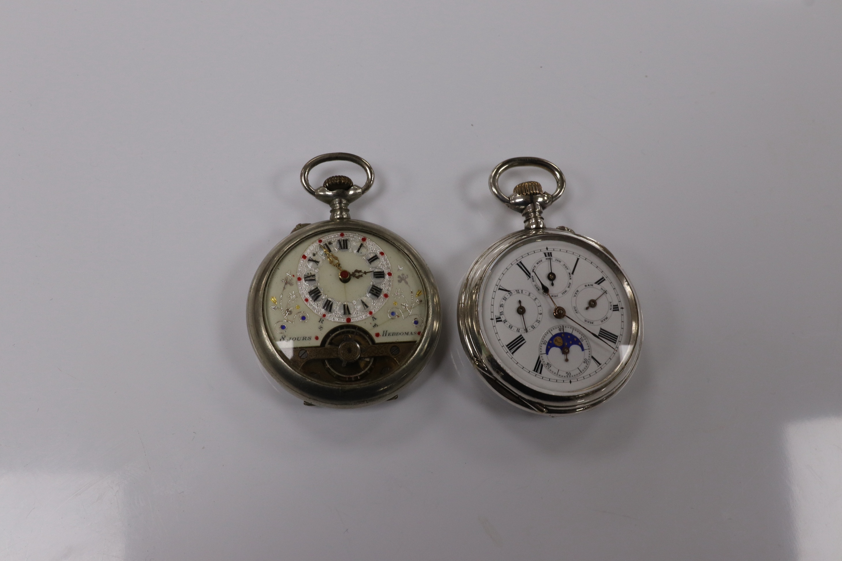 Two nickel or chrome cased pocket watches, Hebdomas, case diameter 50mm and calendar, case diameter 50mm. Condition - fair